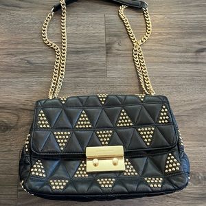 Michael Kors black bag with gold stud detail.